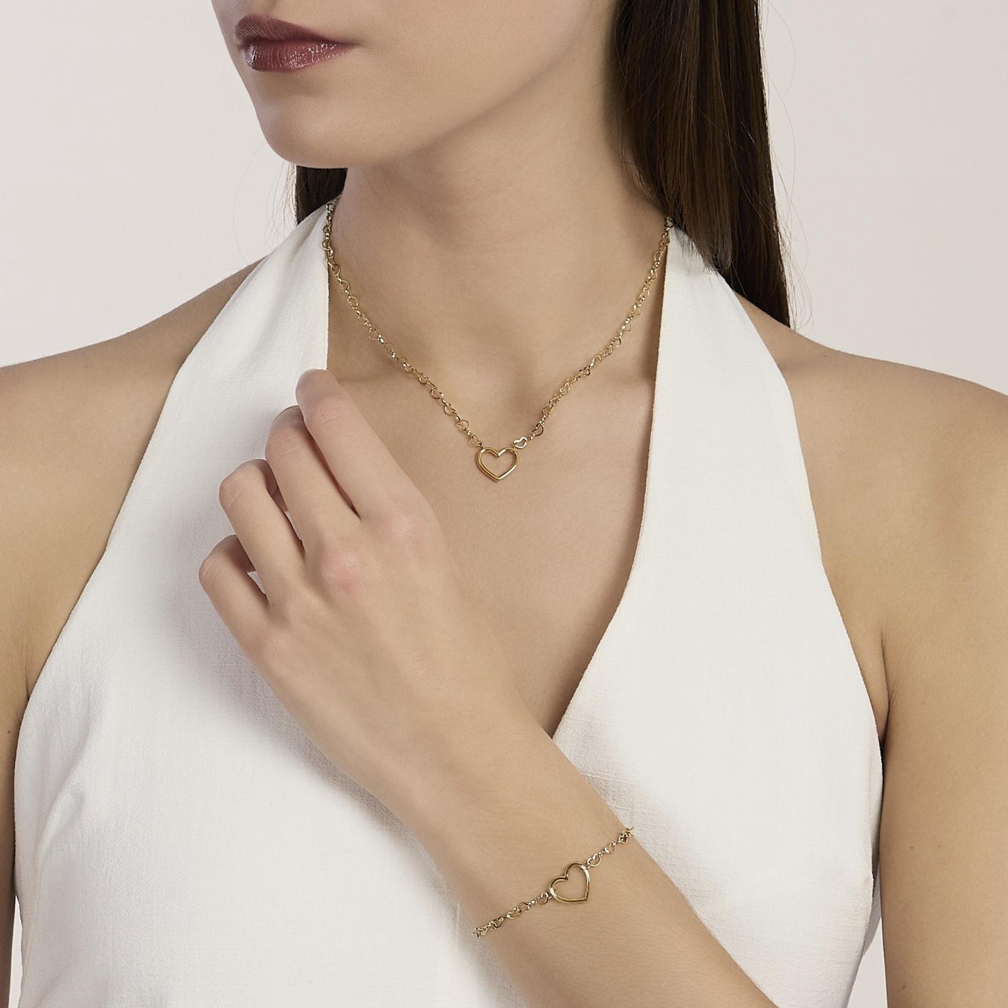Bracciale Kidult Style 64 831216 in acciaio PVD oro giallo con catena a maglia di cuori e pendente centrale - Alfano Gioielli Palermo.