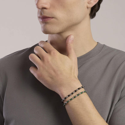 Bracciale a catena Kidult in acciaio dorato con piccole pietre naturali di apatite azzurra alternate.