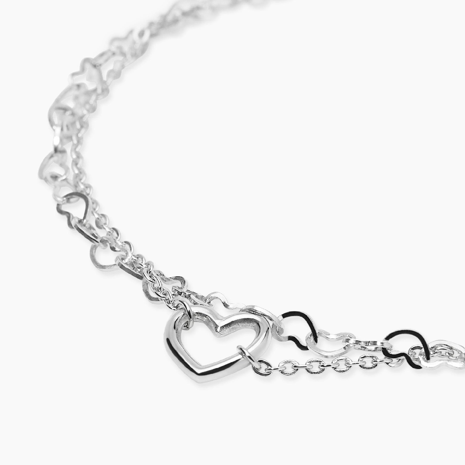 Bracciale Kidult Style 64 831215 in acciaio 316L a doppia catena con motivo a cuori e cuore centrale - Alfano Gioielli Palermo.